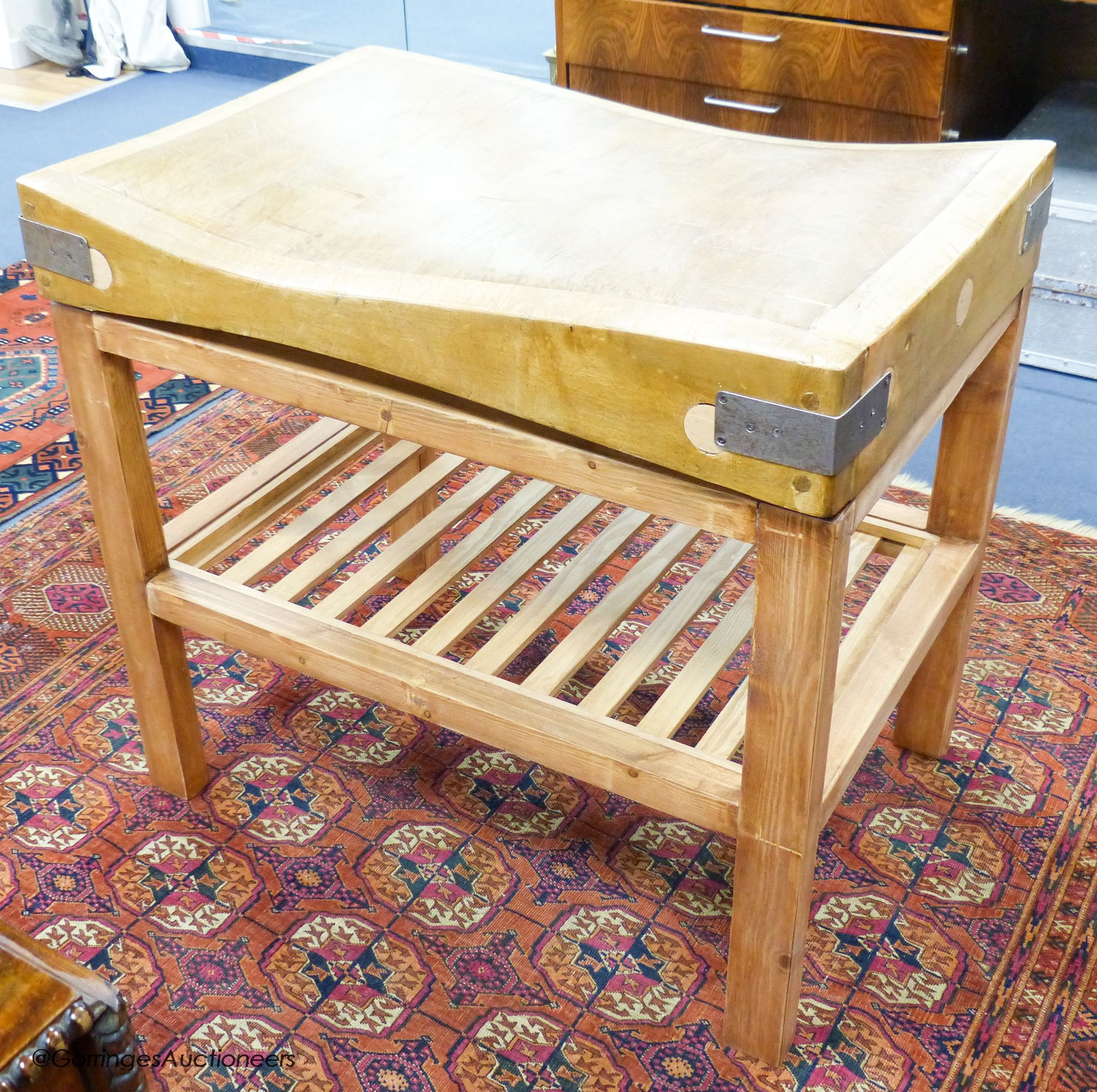 A beech butcher's block on a pine stand, 91.5cm wide